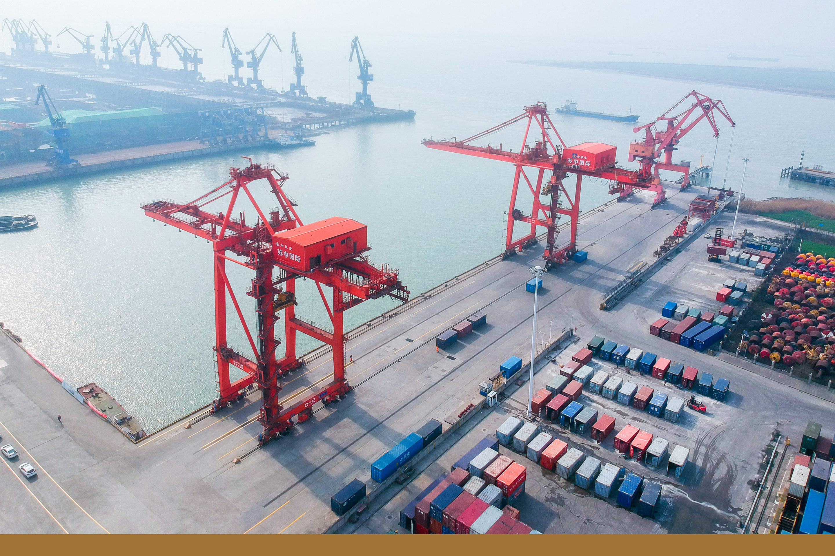 An aerial view of containers and cranes at an export port in Rugao county-level city